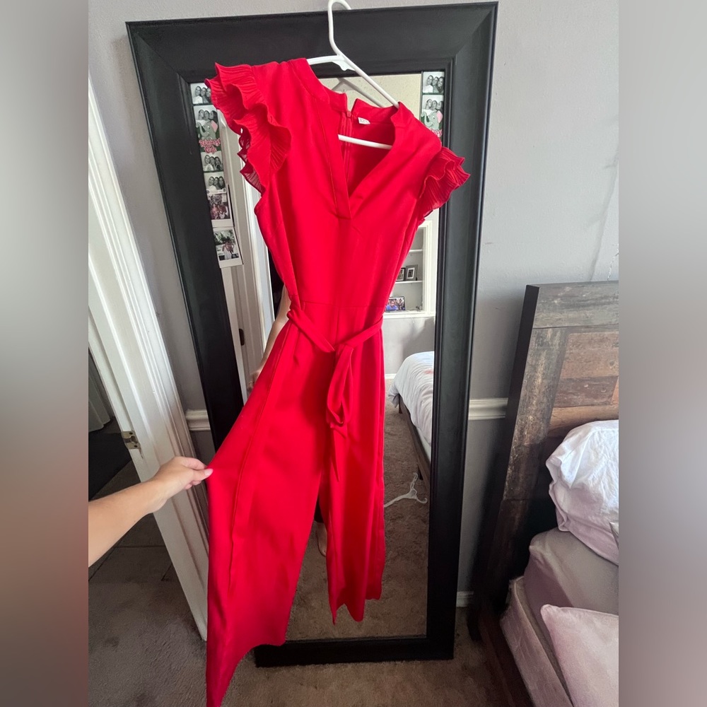 red jumpsuit with ruffle sleeves